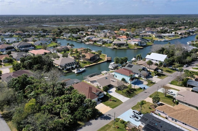 birds eye view of property with a residential view and a water view