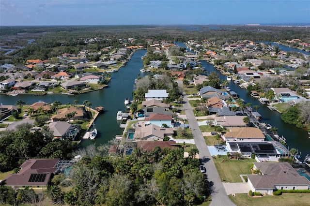 aerial view with a residential view and a water view