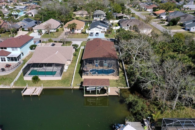 aerial view featuring a residential view and a water view