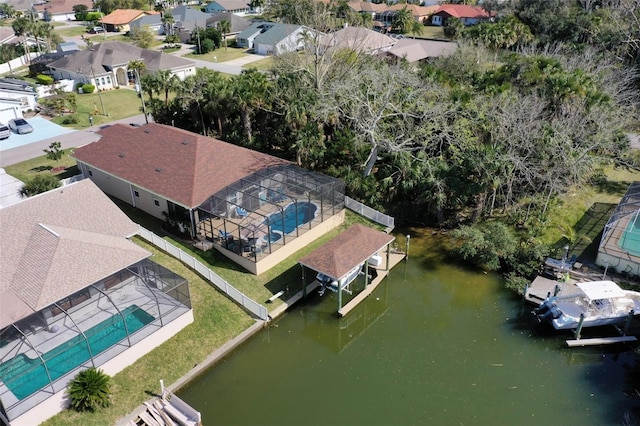 bird's eye view featuring a water view and a residential view