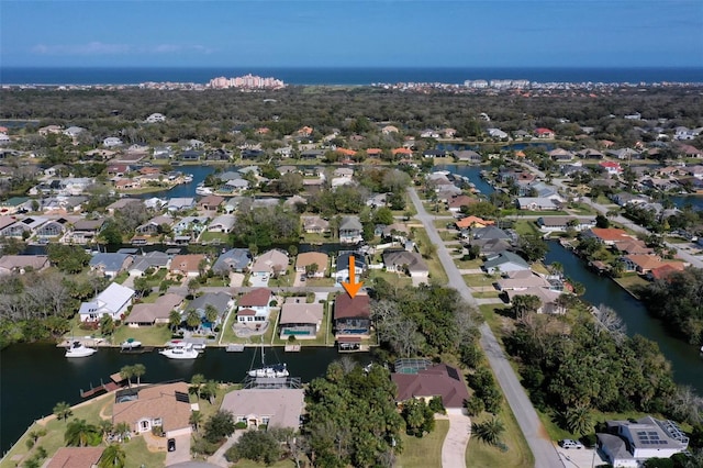 aerial view featuring a water view and a residential view