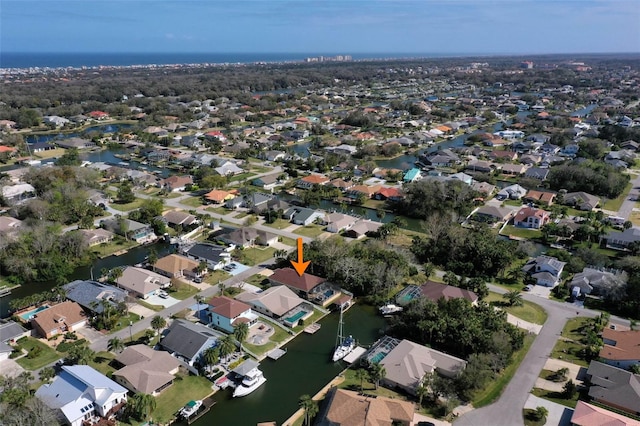 aerial view with a water view and a residential view