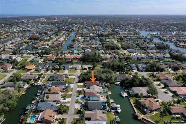 aerial view with a residential view and a water view