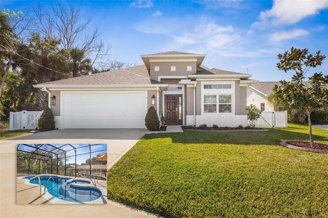 view of front of property with a garage, fence, a gate, stucco siding, and a front yard