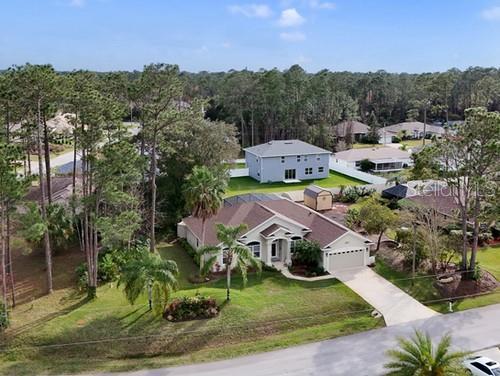 drone / aerial view with a view of trees