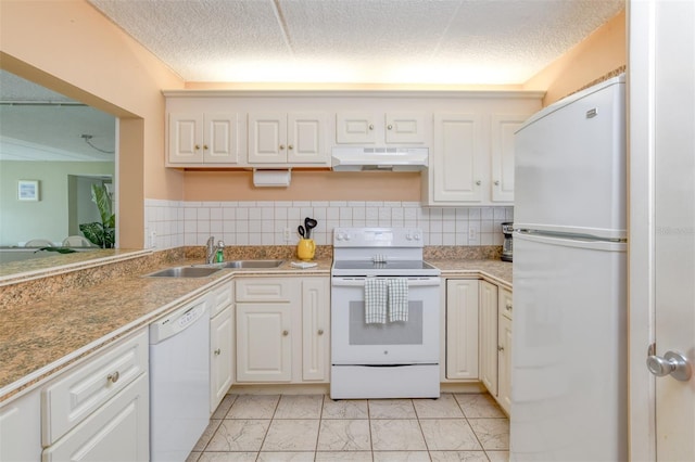 kitchen with marble finish floor, a sink, a textured ceiling, white appliances, and under cabinet range hood