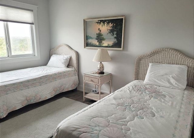 bedroom with wood finished floors