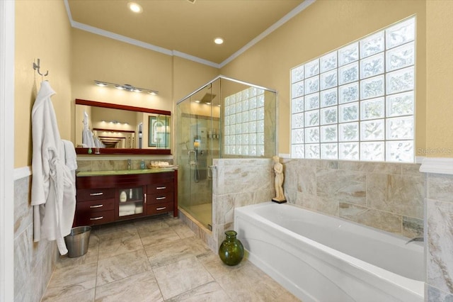 full bath with a bath, a shower stall, crown molding, and vanity