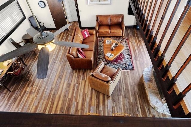 living area featuring stairs and wood finished floors