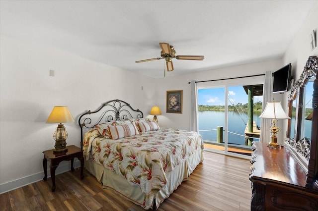 bedroom featuring access to outside, baseboards, ceiling fan, and wood finished floors