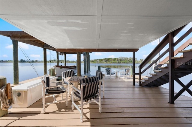 dock area with a water view and stairway