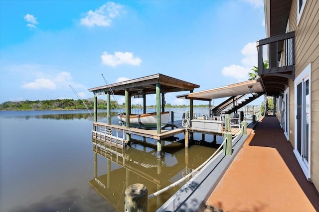 view of dock with a water view and boat lift