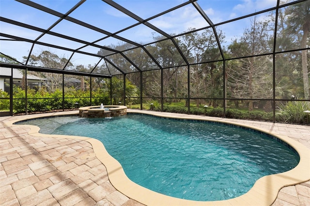 view of swimming pool with a patio, glass enclosure, and a pool with connected hot tub