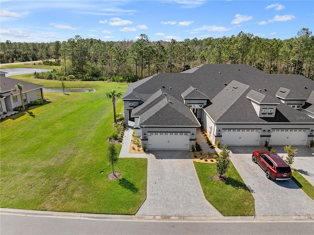 drone / aerial view with a view of trees