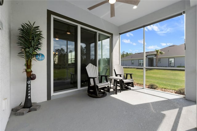 sunroom with a ceiling fan