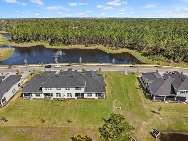 bird's eye view with a water view and a wooded view