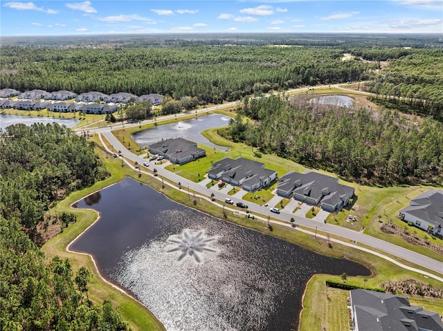 bird's eye view with a water view, a residential view, and a view of trees