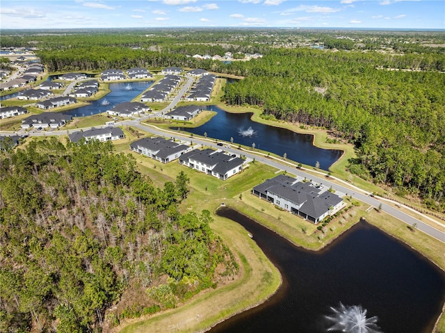 bird's eye view featuring a residential view, a water view, and a view of trees