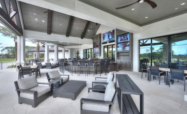 view of patio / terrace with ceiling fan, outdoor dry bar, and an outdoor hangout area