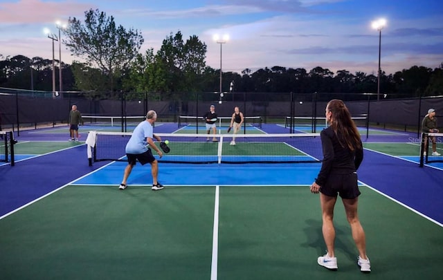 view of sport court with fence