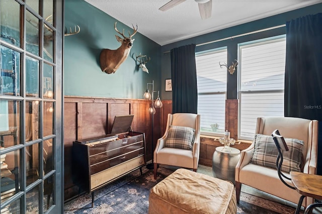 562 Kendall Crossing Dr, Saint Johns, FL 32259 - living area featuring wainscoting and a ceiling fan