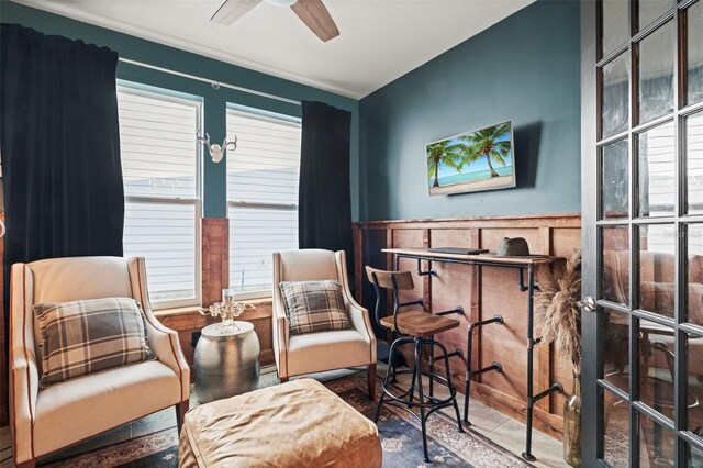 562 Kendall Crossing Dr, Saint Johns, FL 32259 - living area featuring ceiling fan and wainscoting