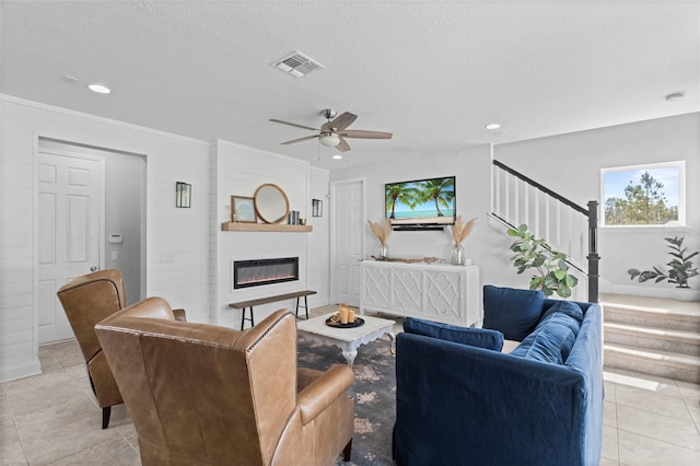 562 Kendall Crossing Dr, Saint Johns, FL 32259 - living room with visible vents, light tile patterned floors, ceiling fan, a fireplace, and recessed lighting