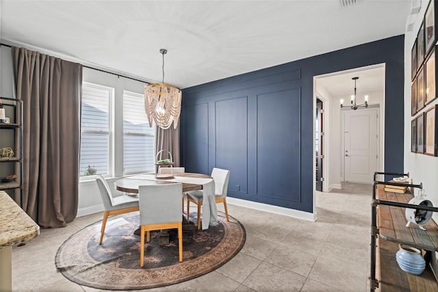 562 Kendall Crossing Dr, Saint Johns, FL 32259 - dining area with a notable chandelier, baseboards, visible vents, and light tile patterned flooring