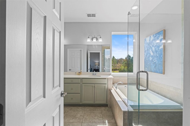 562 Kendall Crossing Dr, Saint Johns, FL 32259 - bathroom featuring visible vents, a bath, vanity, and tile patterned floors