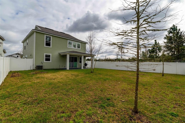 562 Kendall Crossing Dr, Saint Johns, FL 32259 - back of property featuring a yard, a fenced backyard, and central AC unit