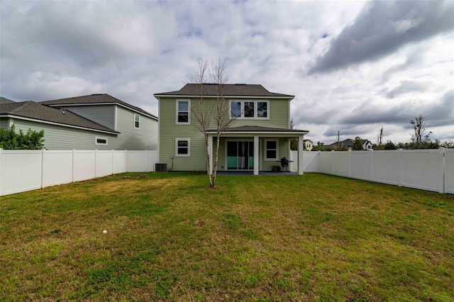 562 Kendall Crossing Dr, Saint Johns, FL 32259 - rear view of house featuring central air condition unit, a yard, and a fenced backyard