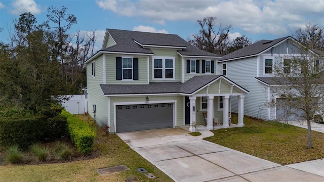 562 Kendall Crossing Dr, Saint Johns, FL 32259 - traditional home with a shingled roof, an attached garage, fence, concrete driveway, and a front lawn