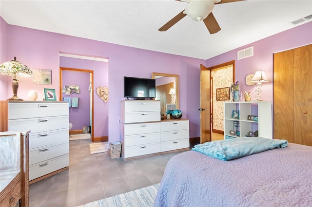 bedroom with tile patterned floors, visible vents, baseboards, and a ceiling fan