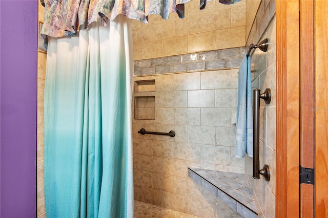 bathroom with tiled shower