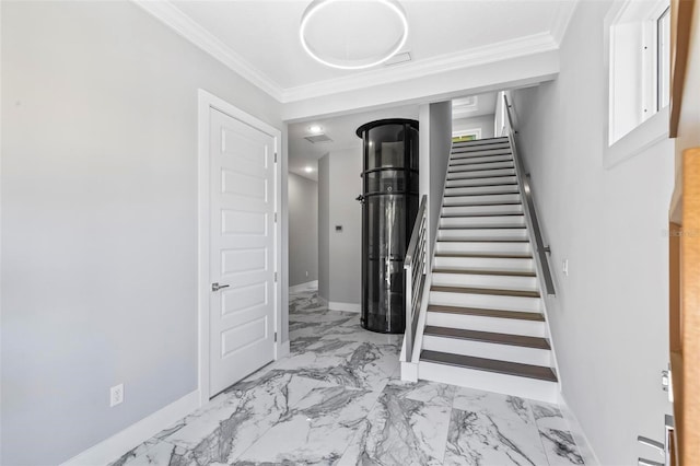 staircase with marble finish floor, baseboards, and ornamental molding