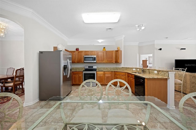 kitchen with light stone counters, stainless steel appliances, visible vents, ornamental molding, and a peninsula