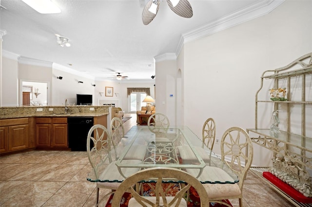 dining room with ceiling fan, ornamental molding, and light tile patterned flooring