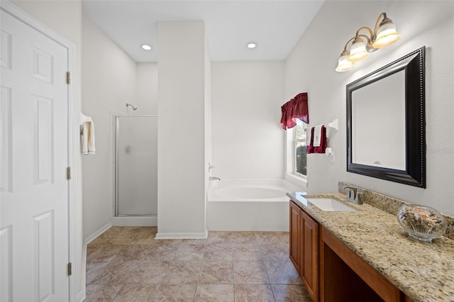 bathroom featuring recessed lighting, a shower stall, vanity, and a bath