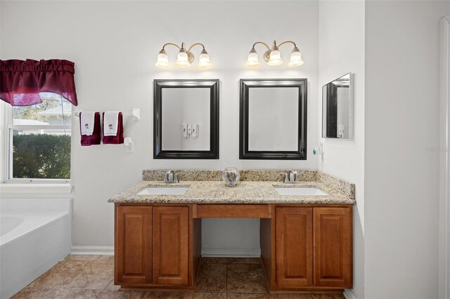 bathroom featuring double vanity, a sink, and a bathtub