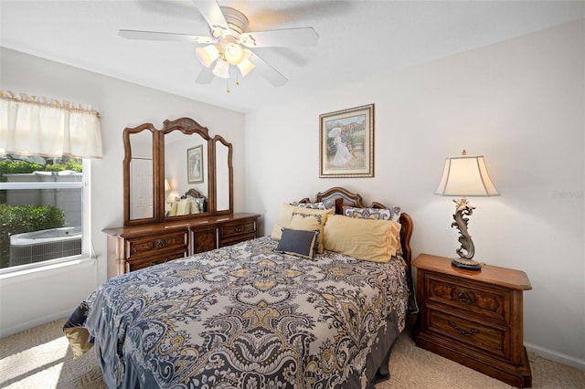 bedroom featuring carpet, a ceiling fan, and baseboards