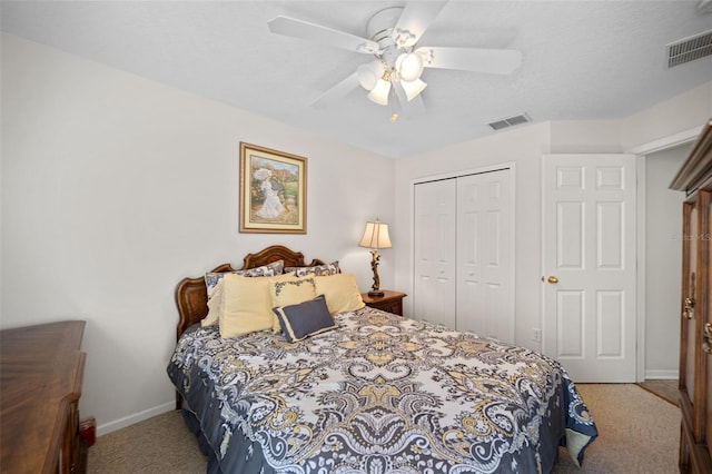 bedroom featuring carpet, a closet, visible vents, and baseboards