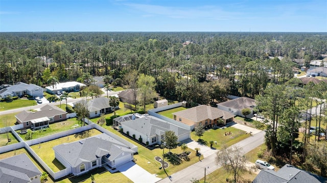 aerial view with a residential view and a view of trees