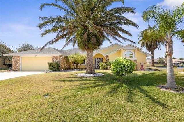 view of front of property with a garage, driveway, a front lawn, and stucco siding