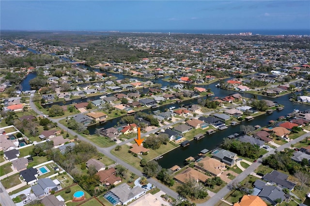 aerial view with a water view and a residential view