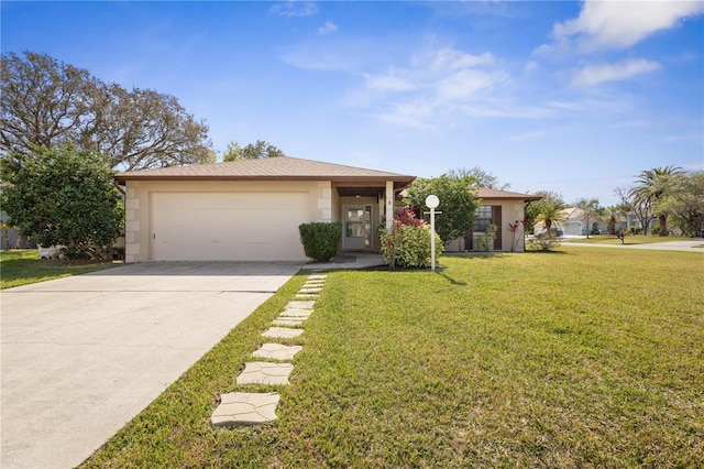 view of front of home featuring an attached garage, concrete driveway, and a front yard