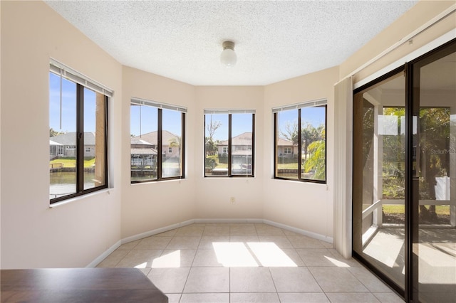 unfurnished sunroom with a wealth of natural light