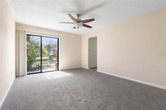 spare room featuring carpet, ceiling fan, a textured ceiling, and baseboards