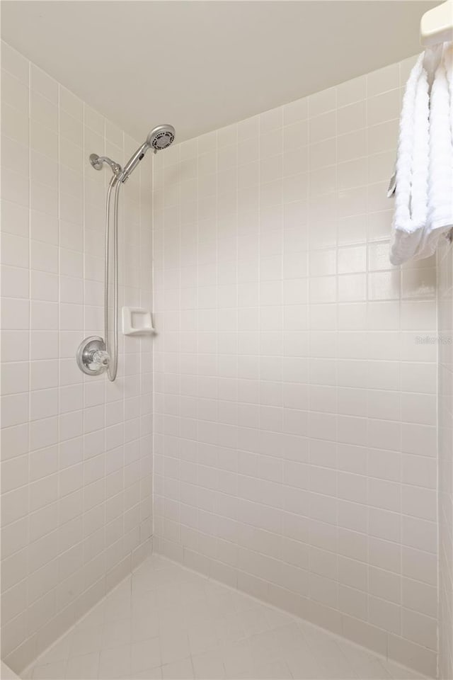 full bathroom with tiled shower