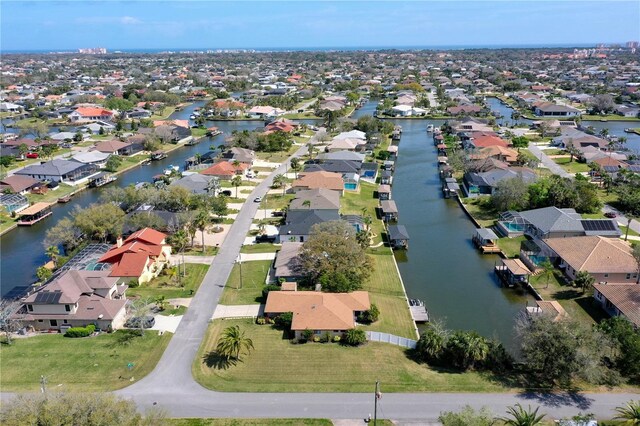 bird's eye view featuring a water view and a residential view