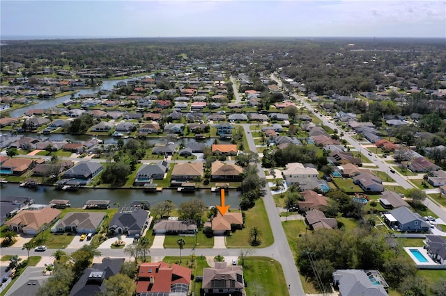 aerial view featuring a residential view and a water view